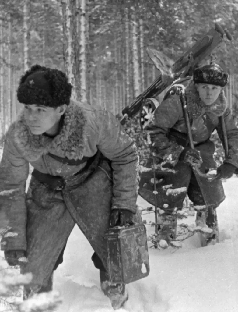In 1940, two members of a Red Army machine gun crew in Finland were wearing earflaps and Finnish caps